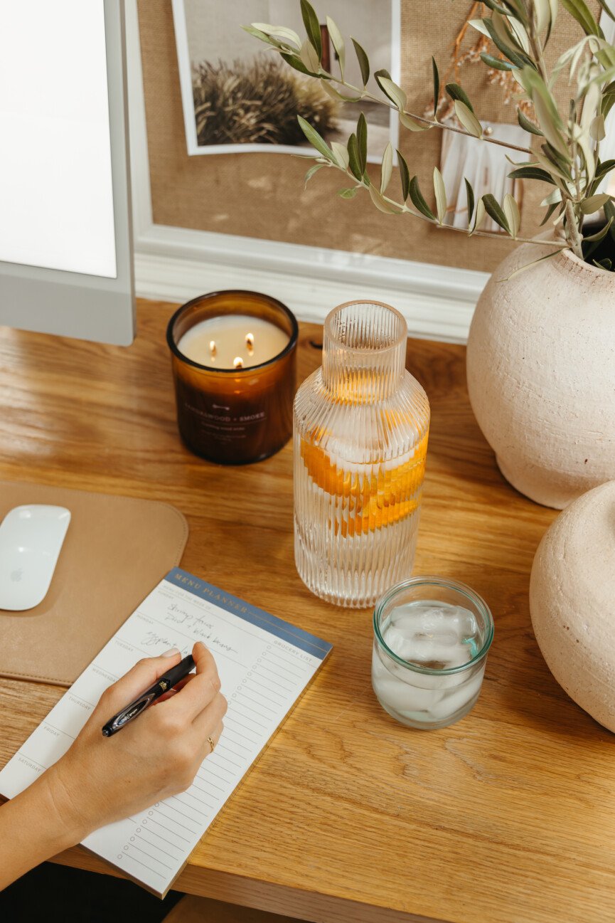 Woman writing in planner